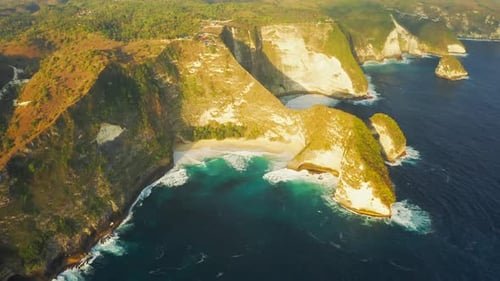 Mountains and Azure Lagoon with Clear Water of Indian Ocean. Manta Bay or Kelingking Beach on Nusa
