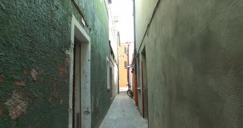 Narrow alley with colourful houses