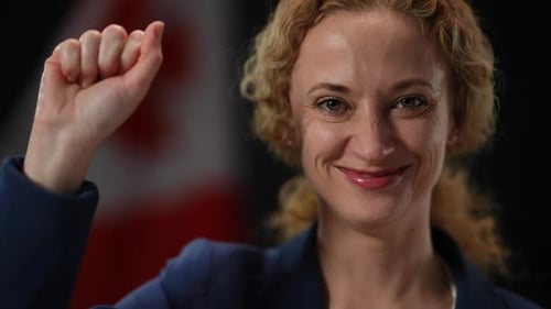 Smiling Woman Celebrating With Fist In The Air