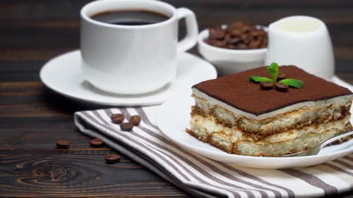 Delicious Tiramisu with Coffee on Wooden Table