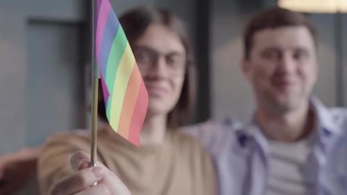 Rainbow Pride Flag Held Up Indoors