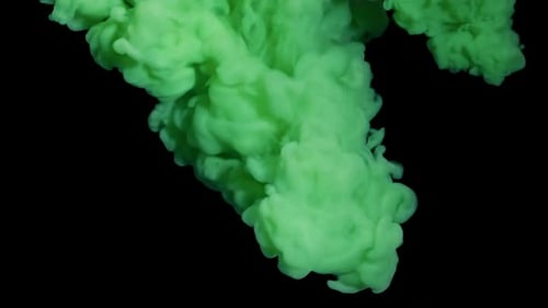 Bright Green Ink Spreading on a Black Background