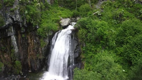 Aerial View of Mountain Waterfall and Lush Trees