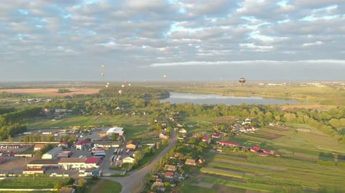 Hot Air Balloons Over Rural Countryside Aerial