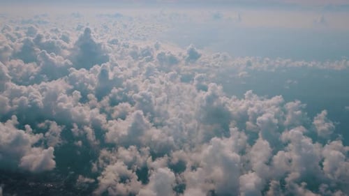Airplane Flying Over Clouds
