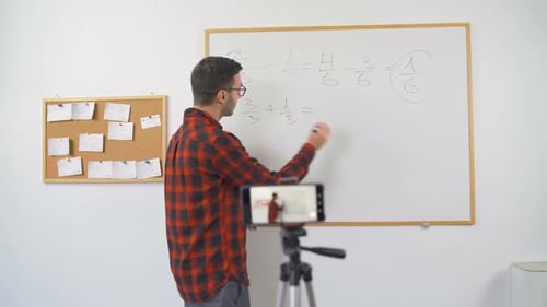 Man Teaching Math Lesson with Smartphone