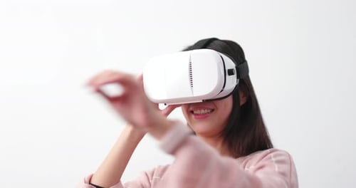 Woman Using VR Headset in a White Room