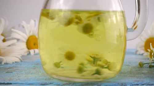 Chamomile Tea Brewing in Glass Pitcher