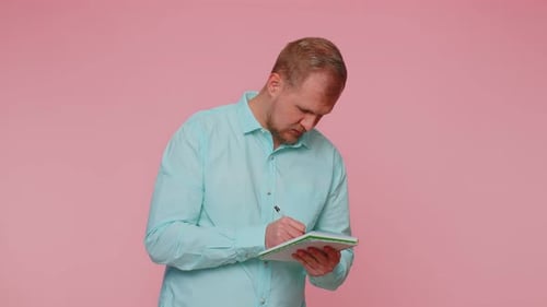 Adult Thinking and Writing in a Notepad