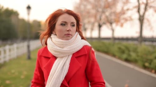 Beautiful Woman in Autumn Park a Cool Windy Day