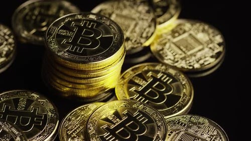 Rotating shot of Bitcoins (digital cryptocurrency) - BITCOIN 0617