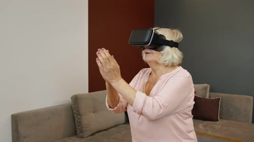 Senior Woman Experiencing Virtual Reality with VR Headset