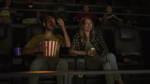 Boyfriend and Girlfriend Watch Comedy Film Laughing Loudly