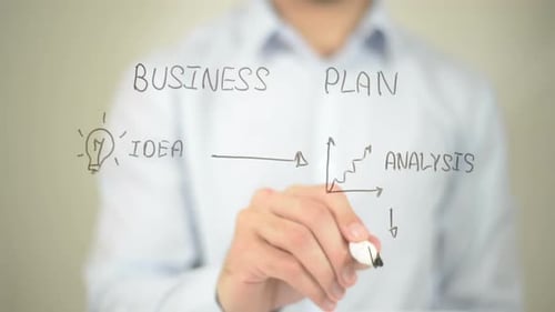 Drawing Business Plan on Glass Surface