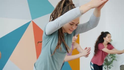 Yoga Class Balancing in Modern Studio