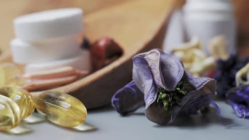 Assorted Pills Capsules Display with Flowers