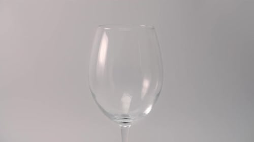 Pouring Red Wine into a Glass