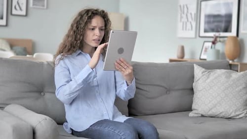 Woman Using Tablet, Reacting with Stress and Anxiety