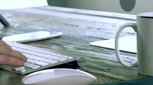 A Caucasian Male Typing on a Wireless Keyboard 05