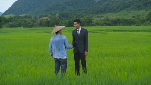 Peasant And Businessman Shaking Hands