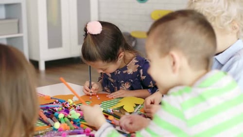 Children Preparing Decorations for Easter