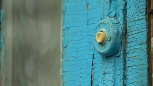 Finger Rings Retro Doorbell on Blue Painted Surface