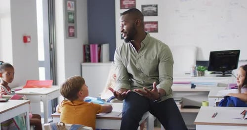 Enthusiastic Students Listening to Teacher in Diverse Classroom
