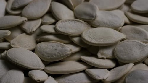 Cinematic, rotating shot of pumpking seeds - PUMPKIN SEEDS 034