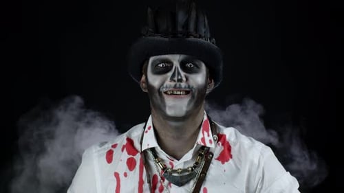 Man in Skull Face Paint Smiling at Camera