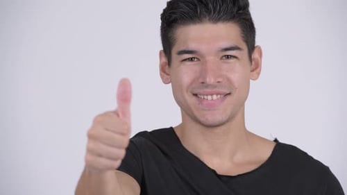 Face of Happy Young Handsome Multi-ethnic Man Giving Thumbs Up