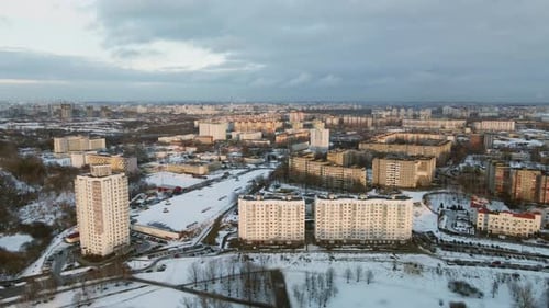 Suburb of a big city. City block from the height of the flight. Pond in the city park.