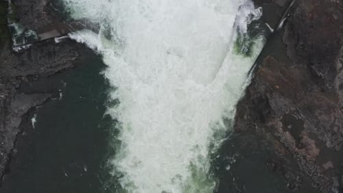 Drone Over Torrents And Calm Waters Of Dam