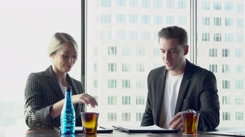 Businessman and businesswoman with partnership deal and handshake and greeting in office.