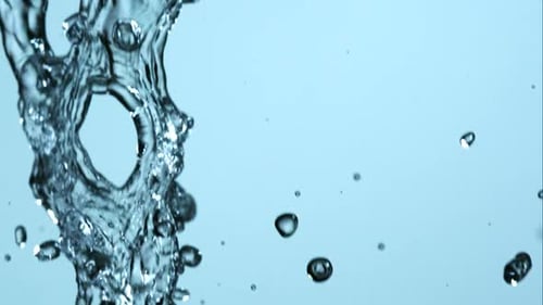 Water pouring and splashing in ultra slow motion 1500fps on a reflective surface - WATER POURS