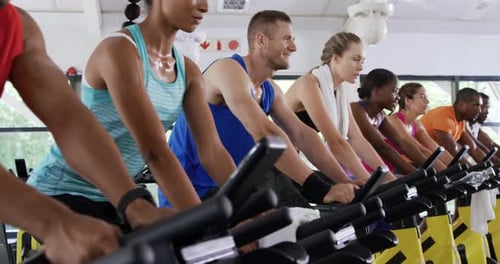 Working out on exercise bikes at a gym