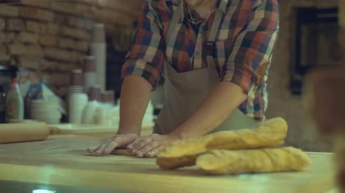 A Male Baker Is Kneading Dough and Making Bread with a Rolling pin.Cooking Process, Culinary, recipe
