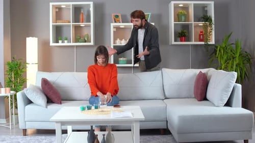 Couple in Conflict in Modern Living Room