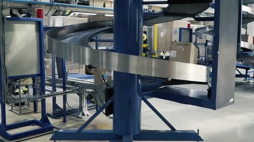 Production Line On Which The Boxes Move In A Spiral