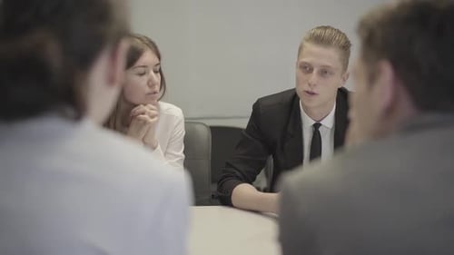 Team Meeting at Modern Office with Young Adults