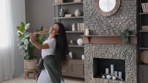 Happy Woman Dancing in Living Room