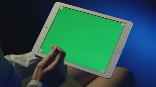 Female Hands Using Tablet with Green Screen