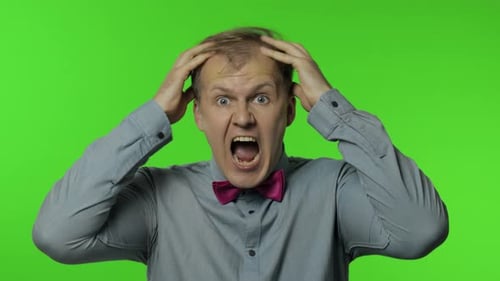 Man Screaming and Frustrated on Green Screen