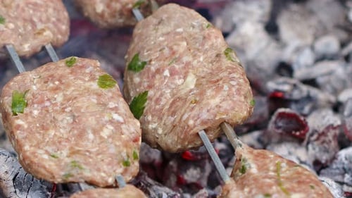Cooking Cow Meatball Food on a Barbecue Wood Fire