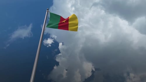 Cameroon Flag Waving Against Dynamic Cloudy Sky