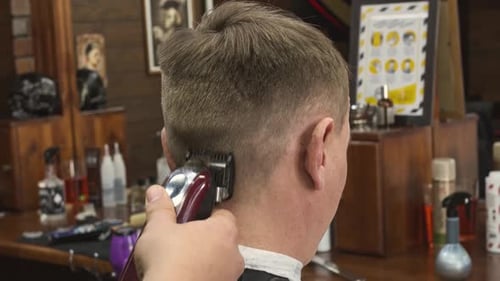 Close Up Barber Giving Haircut in Vintage Shop