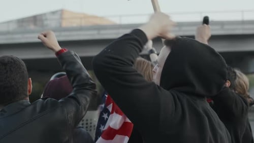 Group Protesting, Raising Fists in the Air