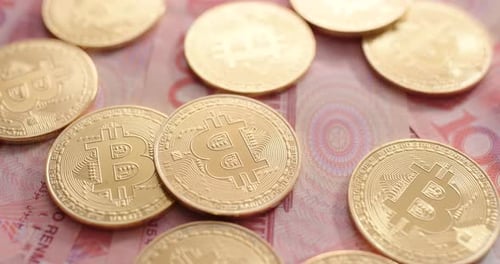 Bitcoins on Chinese Renminbi Currency, Close Up