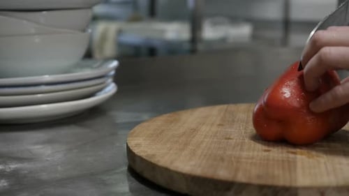 Slicing Red Bell Pepper in Restaurant Kitchen