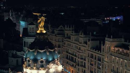 Night Madrid with view to the dome of Metropolis Building, Spain
