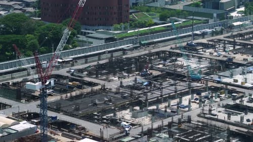 Large Construction Site with Heavy Construction Machinery in Metropolis